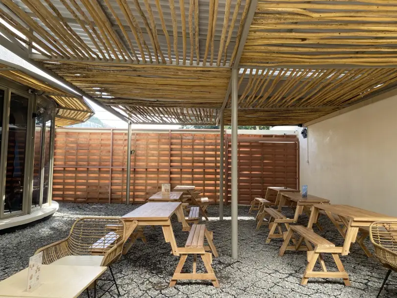 Garden with timber pergola and picnic benches