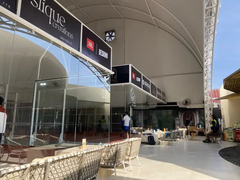 Courts and lounge beneath the curved canopy